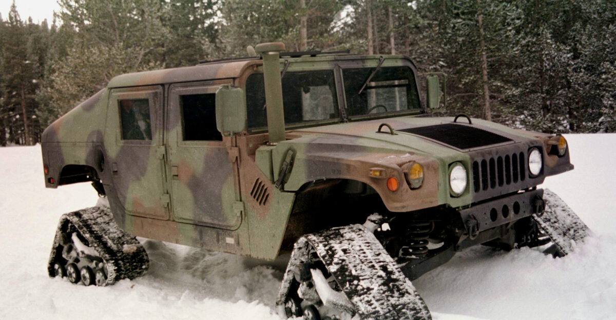A test Humvee equipped with four separate tracks for over the snow mobility is used to support training at the Mountain Warfare Training Center Bridgeport Calif