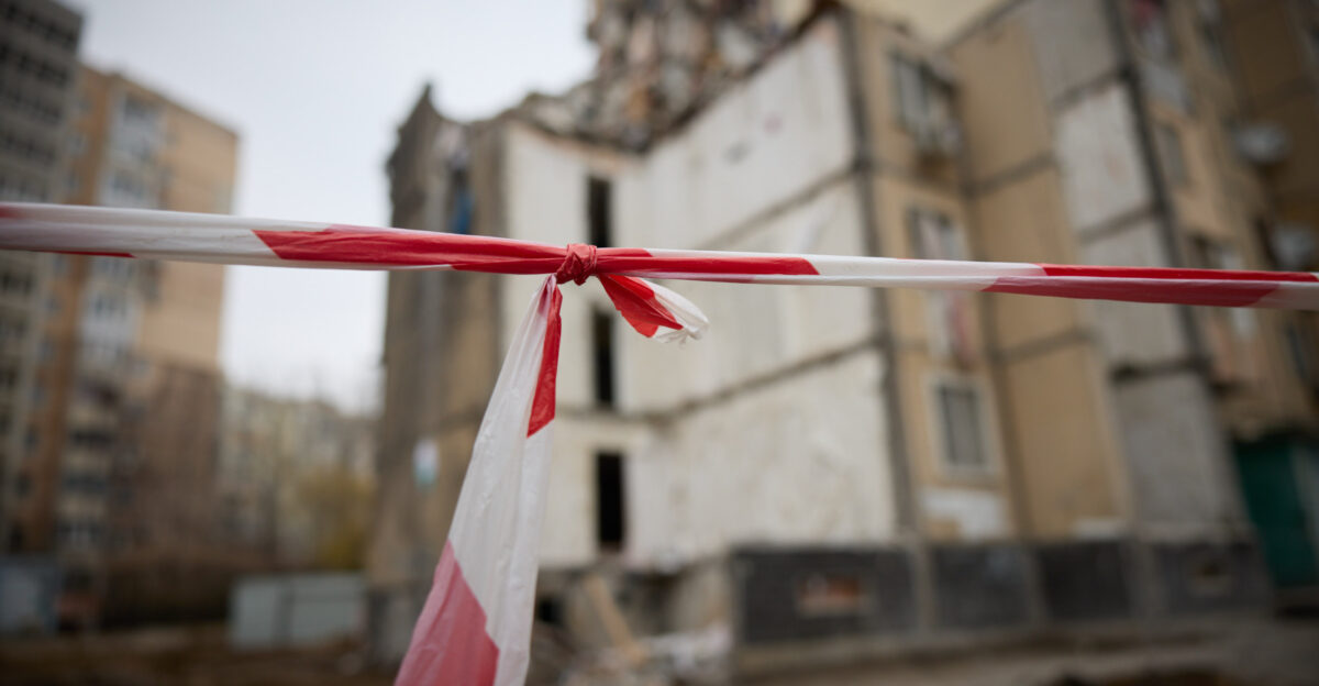 During a working trip to Odesa region President of Ukraine Volodymyr Zelenskyy and Prime Minister of Greece Kyriakos Mitsotakis honored the memory of Odesa residents killed on March 2 as a result of a Shahed UAV hitting a nine-story residential building On the night of March 2 another attack by the Russian Federation using kamikaze drones on the city of Odesa completely destroyed 18 apartments and damaged 36 apartments in a high-rise building at 134 Dobrovolskoho Avenue killing 12 people including five children Another nine people were injured The search and rescue operation was completed on March 3 with five people rescued The President of Ukraine spoke with the residents of the damaged nine-story building and neighboring houses The people told Volodymyr Zelenskyy about their experiences during the enemy attack and thanked all the services and local authorities who rescued people and are now providing the necessary assistance The Head of State expressed deep condolences to the families and friends of the victims of the Russian attack and wished a speedy recovery to the injured We understand that this is an enormous pain especially for those who have lost loved ones Volodymyr Zelenskyy said According to him all the relevant services fulfilled their duties helping and fighting for the lives of our people The President emphasized the importance of providing everything necessary for those who lost their homes As for the apartments and the loss of documents the authorities will definitely help with this Everyone will receive compensation for the destroyed housing City and central authorities will take this issue under control the Head of State noted The destroyed section cannot be restored and must be dismantled with further fortification of the supporting structures of the rest of the building The owners of 12 destroyed apartments have applied for compensation under the eRecovery program and six are in the process of applying and collecting documents