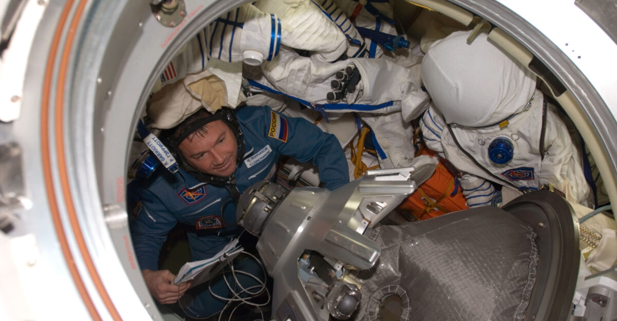 Russian Federal Space Agency cosmonaut Yury Lonchakov Expedition 18 flight engineer ingresses the Earth-facing port of the International Space Station s Zarya module after arriving onboard the Soyuz TMA-13 spacecraft with NASA astronaut Michael Fincke commander and American spaceflight participant Richard Garriott both out of frame Hatches between the two spacecraft were opened at 4 55 a m CDT