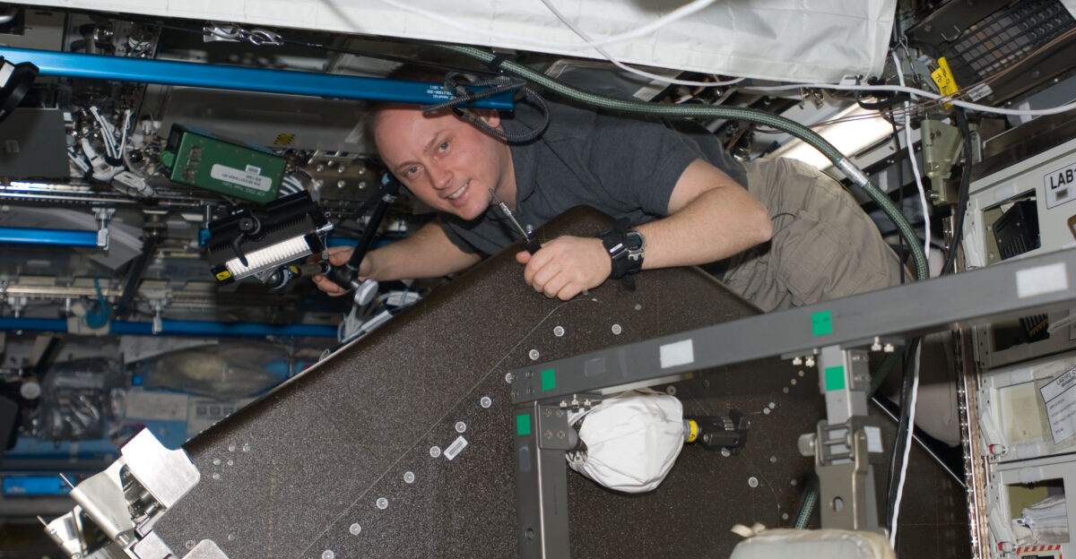 Astronaut Michael Fincke Expedition 18 commander performs a leak check on the Water Recovery System WRS in the Destiny laboratory of the International Space Station