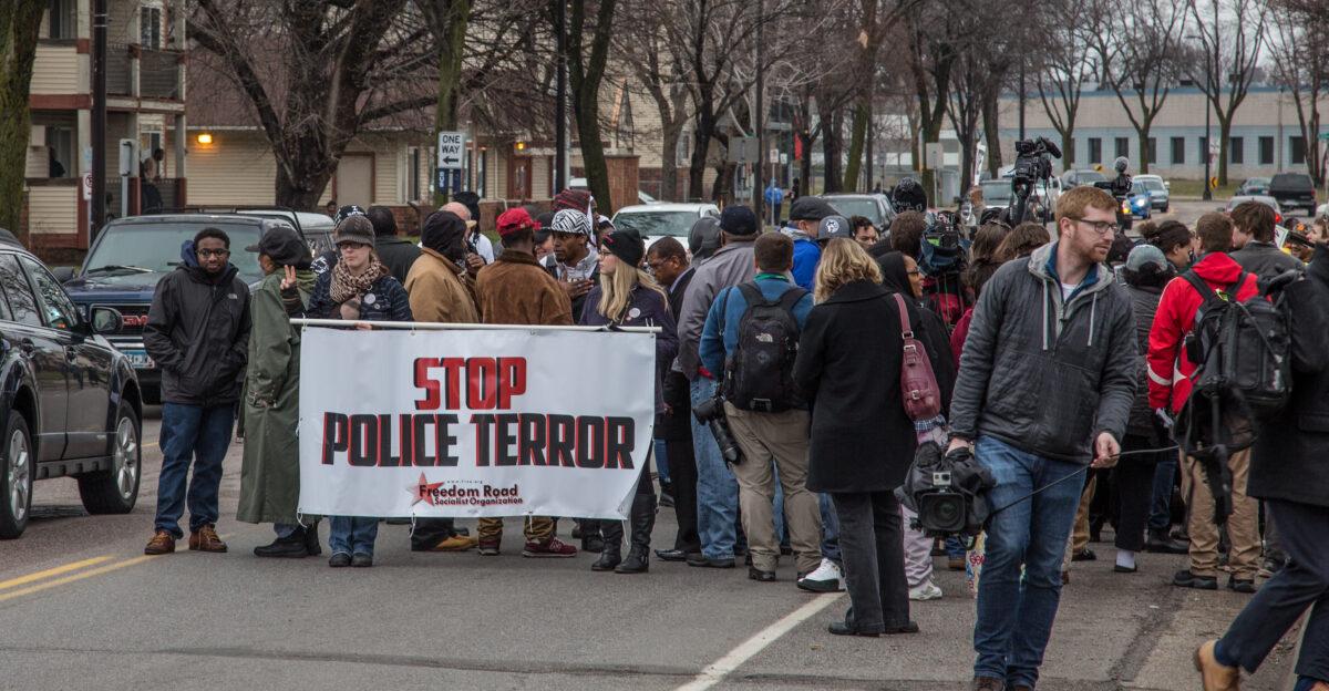 Community members gather outside the location where Jamar Clark was killed by Minneapolis Police following the decision by Hennepin County Attorney Mike Freeman not to charge the officers involved in the shooting on March 30 2016