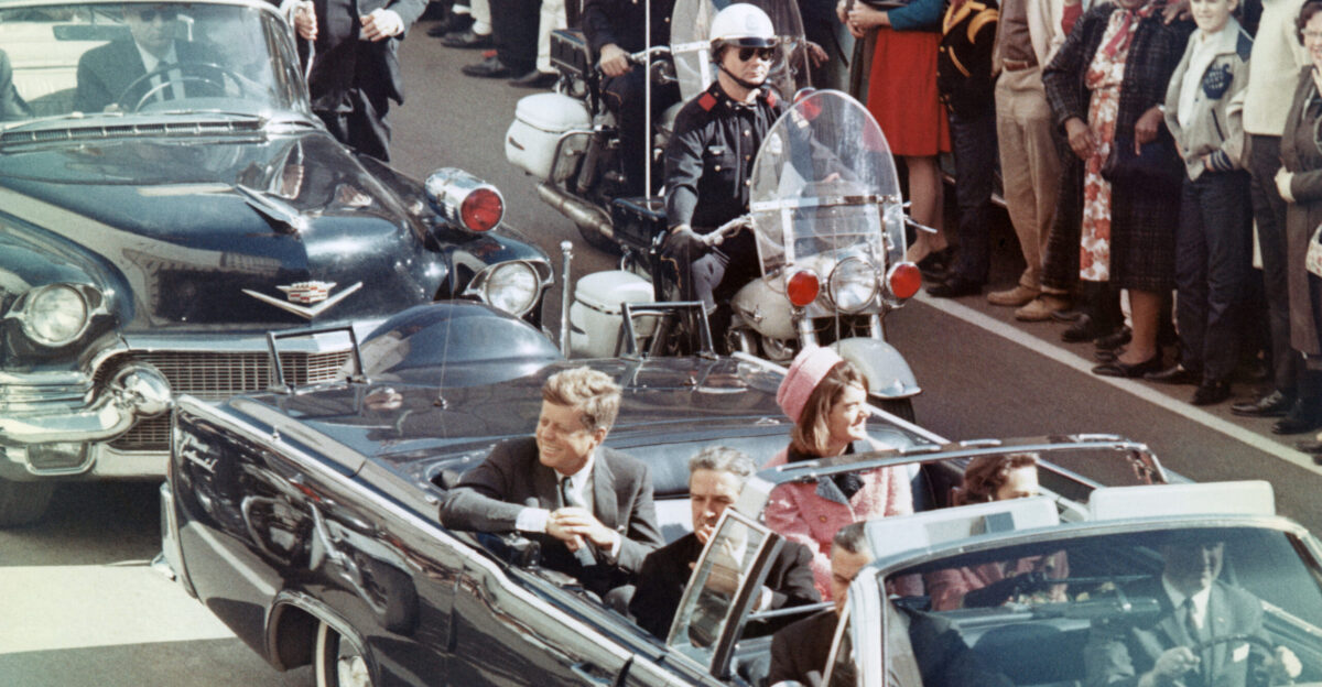 Picture of President Kennedy in the limousine in Dallas Texas on Main Street minutes before the assassination Also in the presidential limousine are Jackie Kennedy Texas Governor John Connally and his wife Nellie