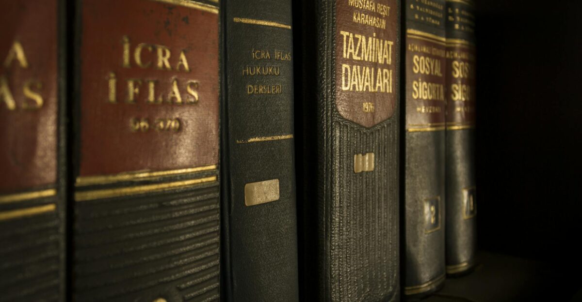 Detailed close-up of law and regulation books on a bookshelf emphasizing education and knowledge