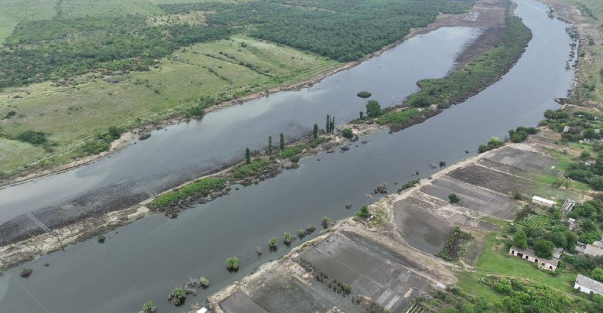 Kalynivske settlement Kherson region of Ukraine after the destruction of the Kakhovka Dam The flooded Ingulets River below and a flooded meadow above