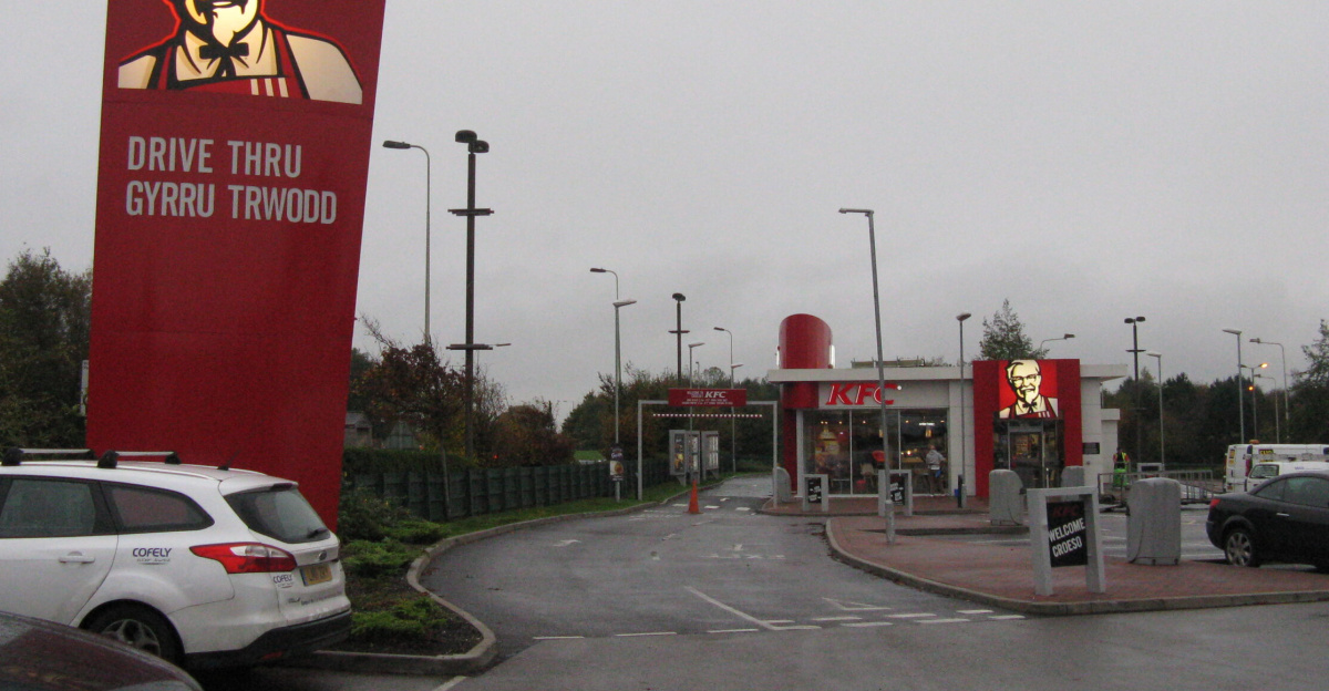 KFC Drive thru [sic]/Gyrru trwodd <span class="mw-valign-text-top" typeof="mw:File/Frameless"><a href="//commons.wikimedia.org/wiki/File:KFC_Drive_thru_(sic)-Gyrru_trwodd_-_geograph.org.uk_-_4227550.jpg#ooui-php-4" title="Edit this at Structured Data on Commons"><img decoding=