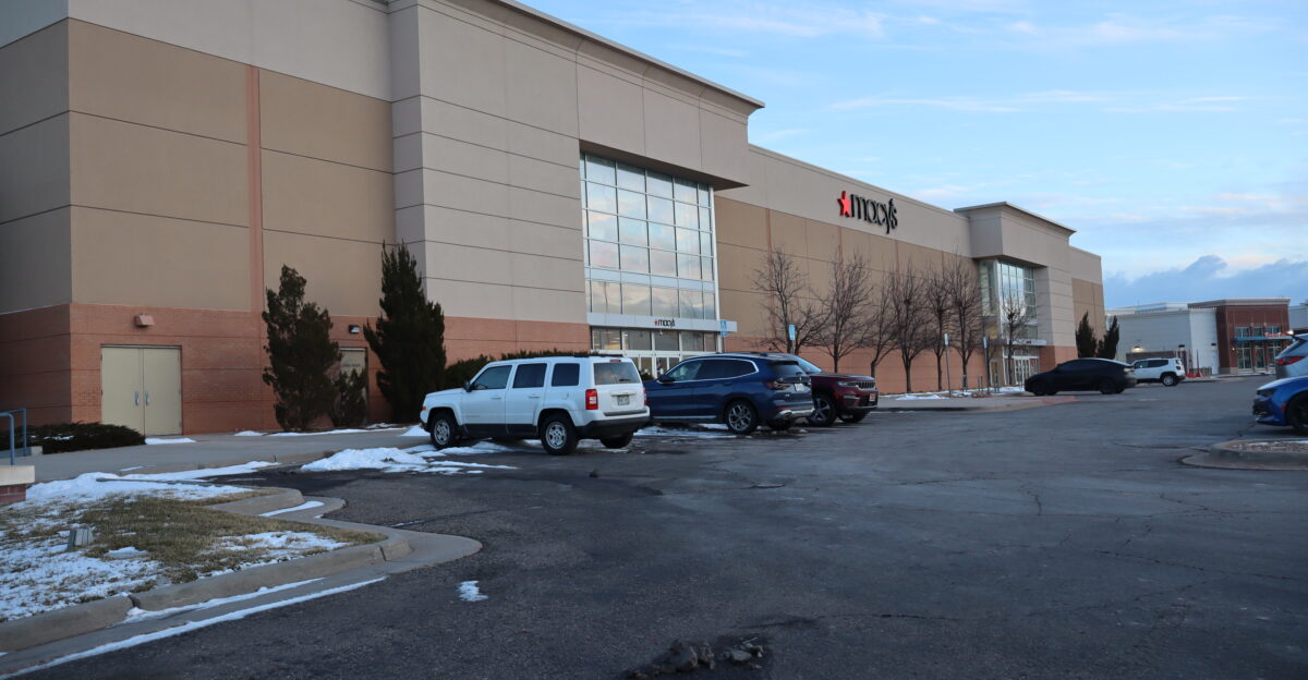 The facade of a Macy s department store on the night of it s announced closure