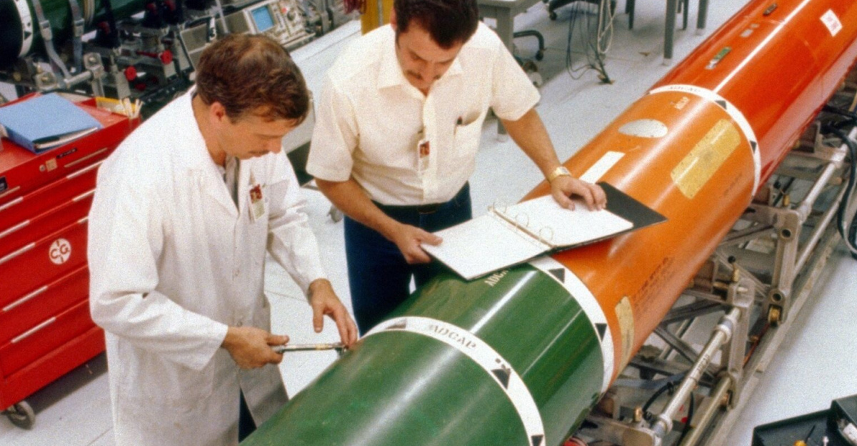 Technicians perform maintenance on a Mark 48 advanced capabilities torpedo at Keyport, Washington in 1982.