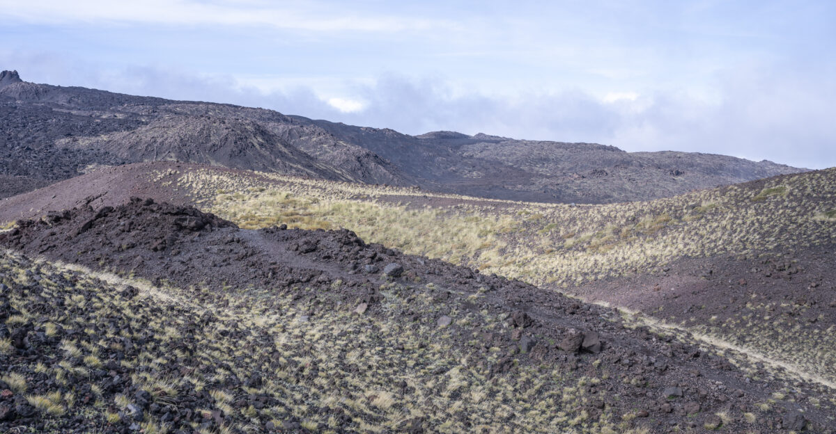 Path in the lava fields of Mount Etna in Sicily Italy
