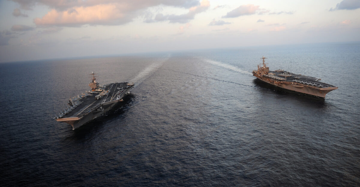 N-YL945-045 ARABIAN SEA Jan 19 2012 The Nimitz-class aircraft carriers USS Abraham Lincoln CVN 72 and USS John C Stennis CVN 74 join for a turnover of responsibility in the Arabian Sea Both ships are deployed to the U S 5th Fleet area of responsibility U S Navy photo by Mass Communication Specialist 2nd Class Colby K Neal Released