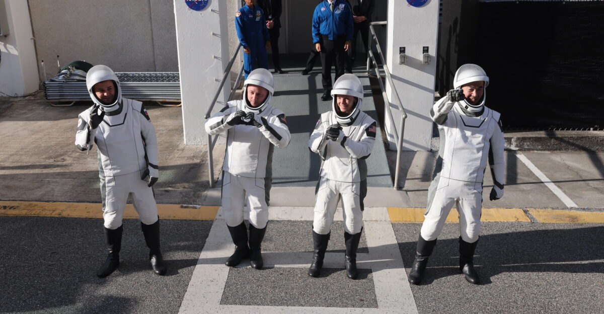 From right to left JAXA Japan Aerospace Exploration Agency astronaut Kimiya Yui NASA astronauts Zena Cardman and Mike Fincke along with and Roscosmos cosmonaut Oleg Platonov wave to family and friends as they walk out of the Neil A Armstrong Operations and Checkout Building at the agency s Kennedy Space Center in Florida during the second launch attempt of NASA s SpaceX Crew-11 mission to the International Space Station on Friday Aug 1 2025 Crew-11 is scheduled to lift off aboard SpaceX s Dragon spacecraft and Falcon 9 rocket at 11 43 a m EDT from Launch Complex 39A at NASA Kennedy