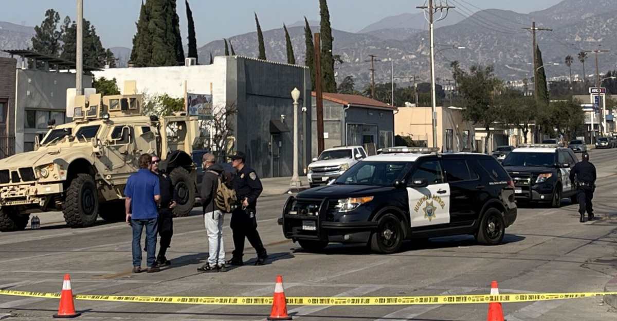 Law enforcement standing guard at the intersection of Montana Street and Fair Oaks Avenue, just south of the border between Pasadena and Altadena