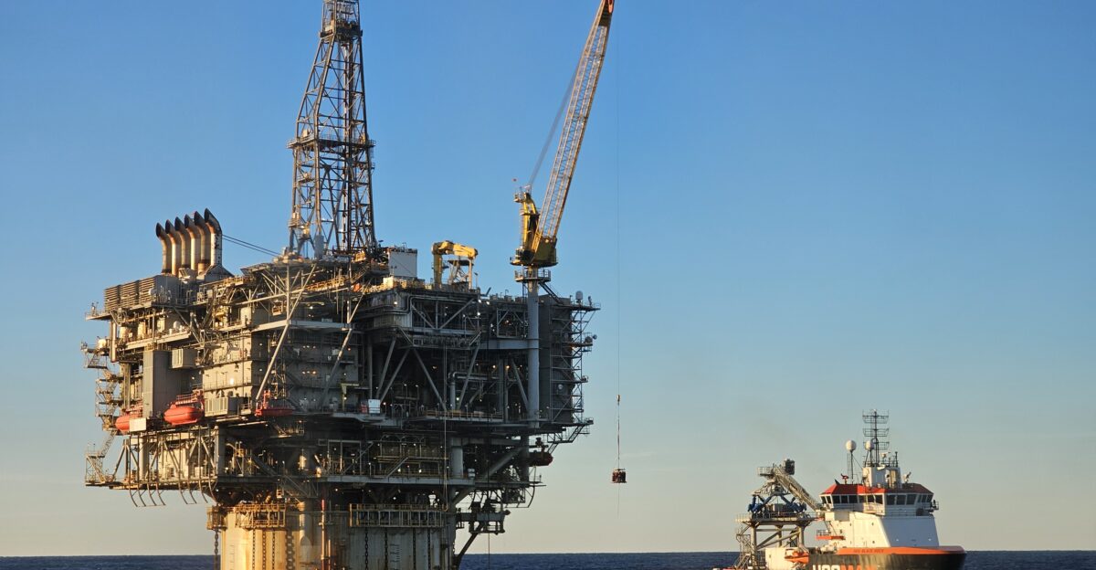 Personnel transfer being conducted between offshore oil platform Holstein and offshore supply vessel HOS Black Rock A crane fixed to the oil platform transports crew from the oil platform onto the boat using a Billy Pugh personnel transfer basket Location Green Canyon Gulf of Mexico approximately 100 miles from land