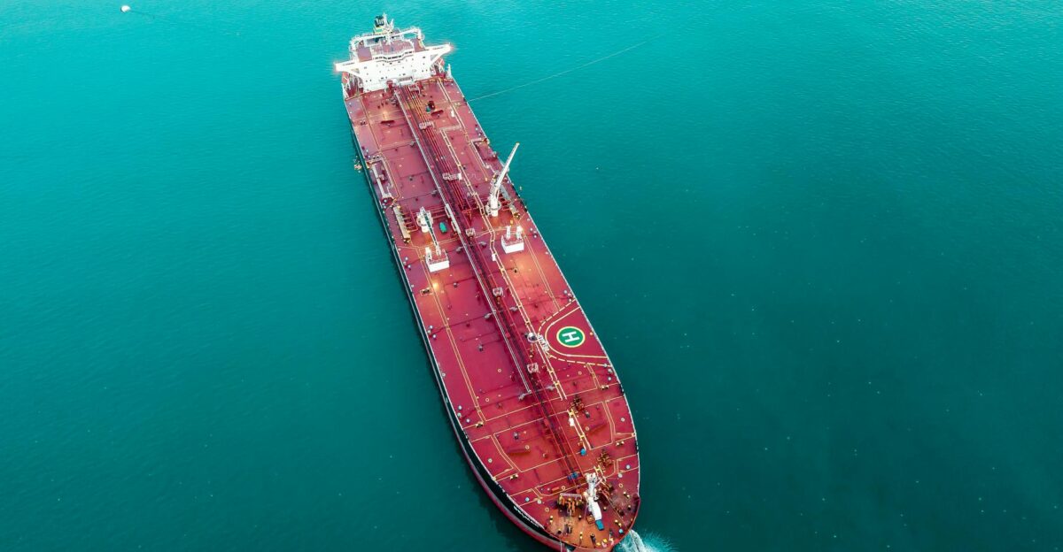 Aerial shot of an oil tanker cruising through the ocean emphasizing maritime transport