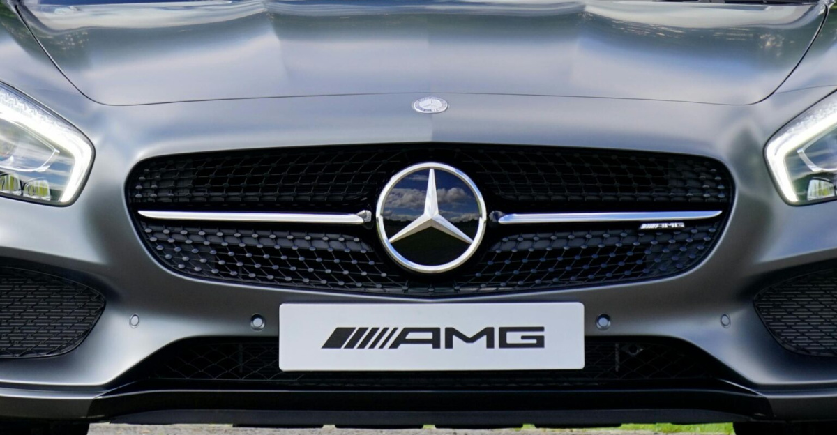 Front view of a luxury Mercedes-Benz AMG against a natural backdrop.