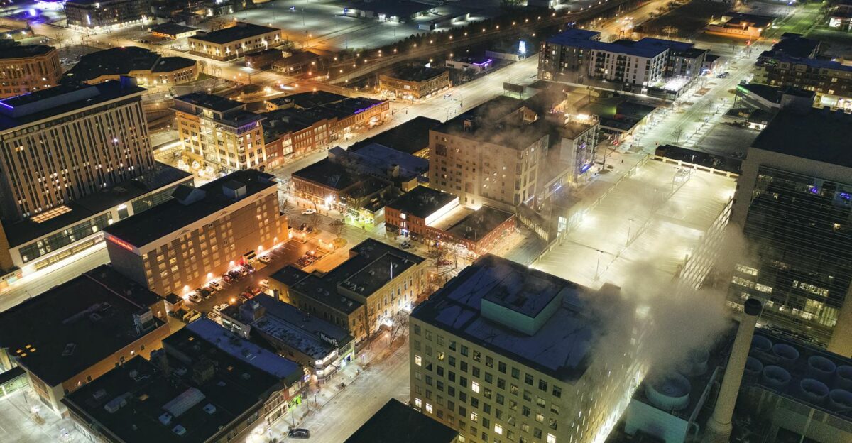 Stunning aerial view of downtown Rochester MN illuminated at night with city lights and streets in view