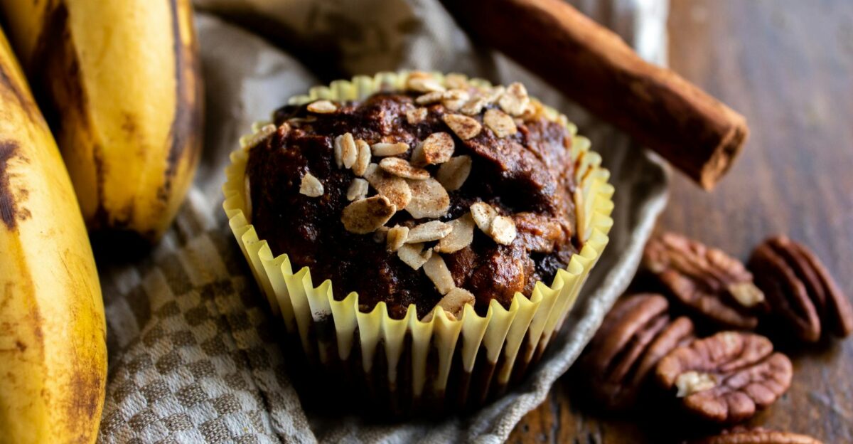 Close-up of a delicious banana oat muffin topped with nuts perfect for a tasty treat