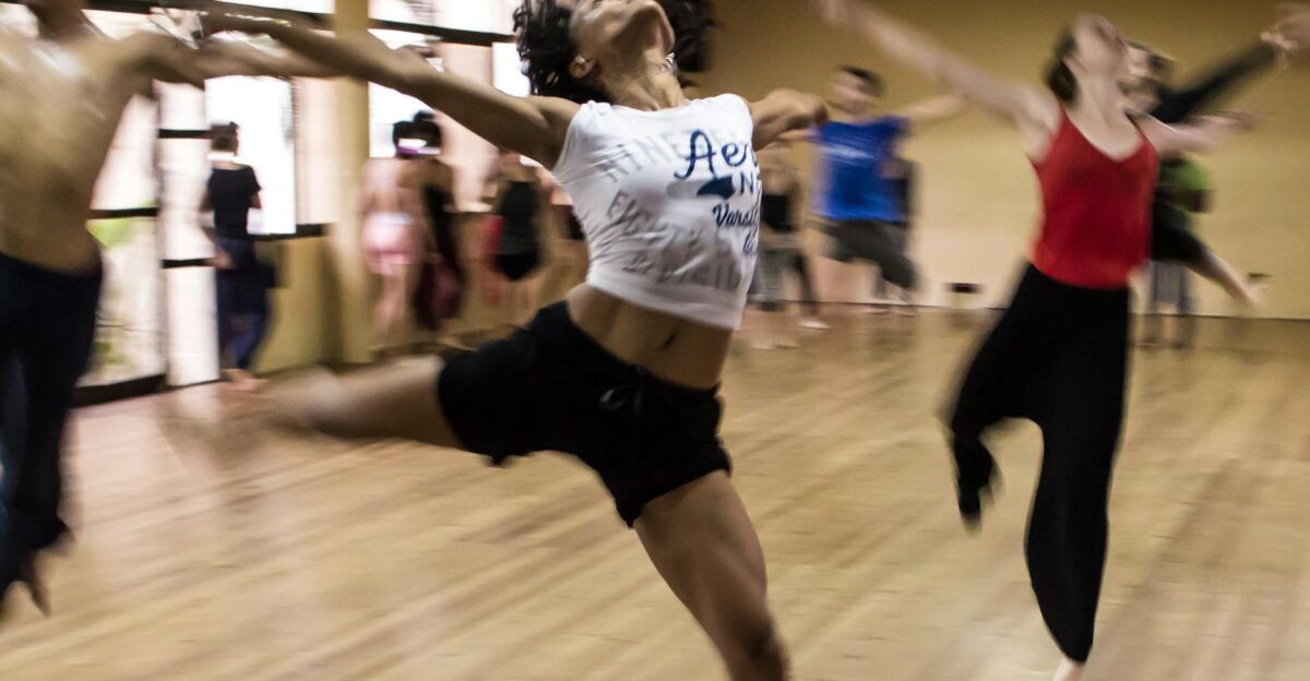 Dynamic group dance class showcasing diverse techniques and spirited expressions