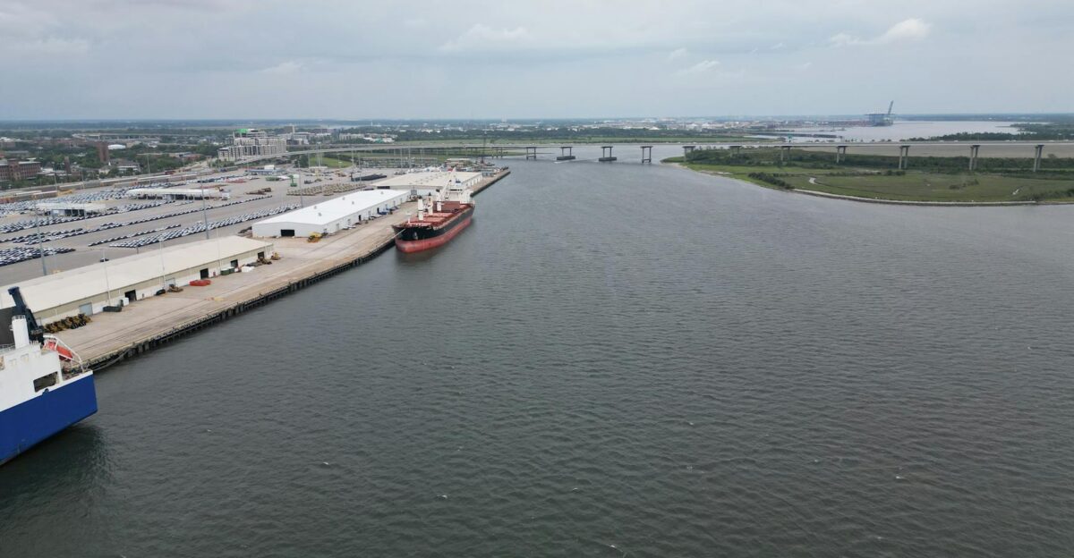 Aerial photo showcasing the busy port of Charleston SC with cargo ships and docks