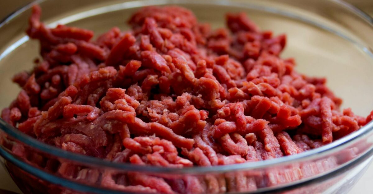 High-quality image of fresh ground beef in a glass bowl ideal for culinary and food-related themes