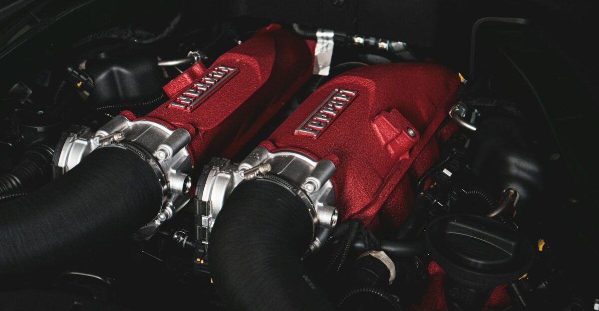 Detailed view of a Ferrari engine showcasing intricate components and design