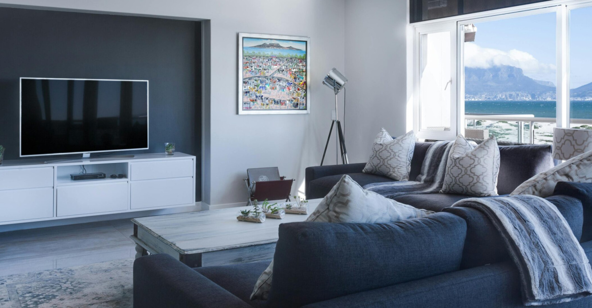 Stylish living room with a view of Table Mountain, blending modern design with natural beauty.