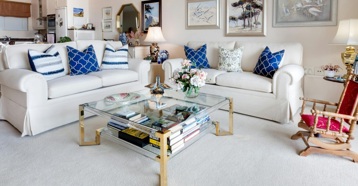 Modern living room with stylish decor and comfortable white sofas.