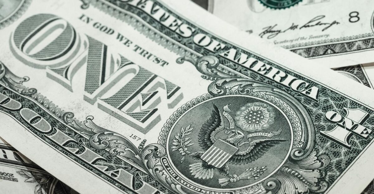 Detailed macro shot of a United States one dollar bill showing various design elements