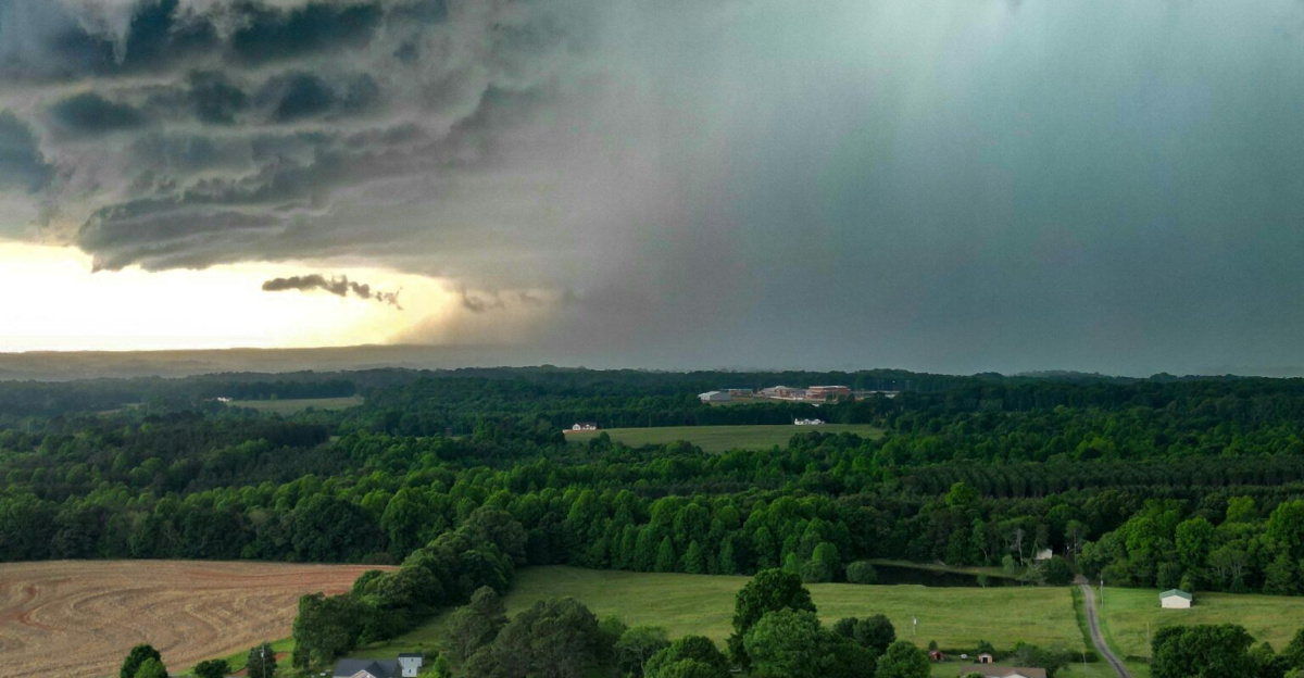 Aerial view of dark storm clouds over countryside in Fallston, NC, showcasing a dramatic weather scene.