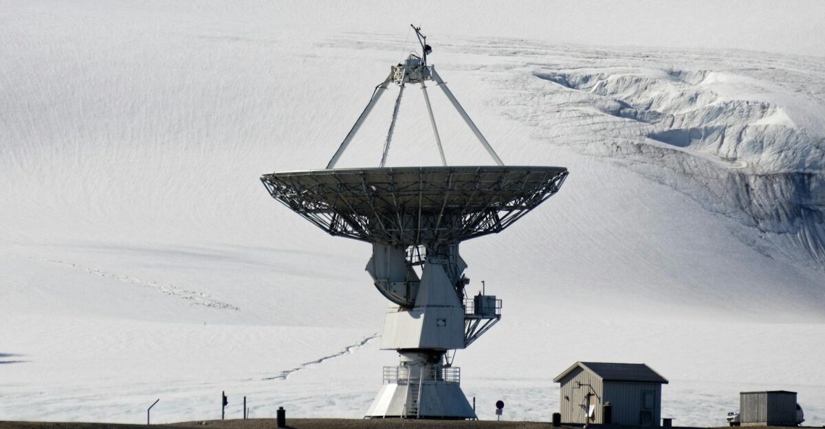 Large satellite dish in a snowy arctic environment for research purposes