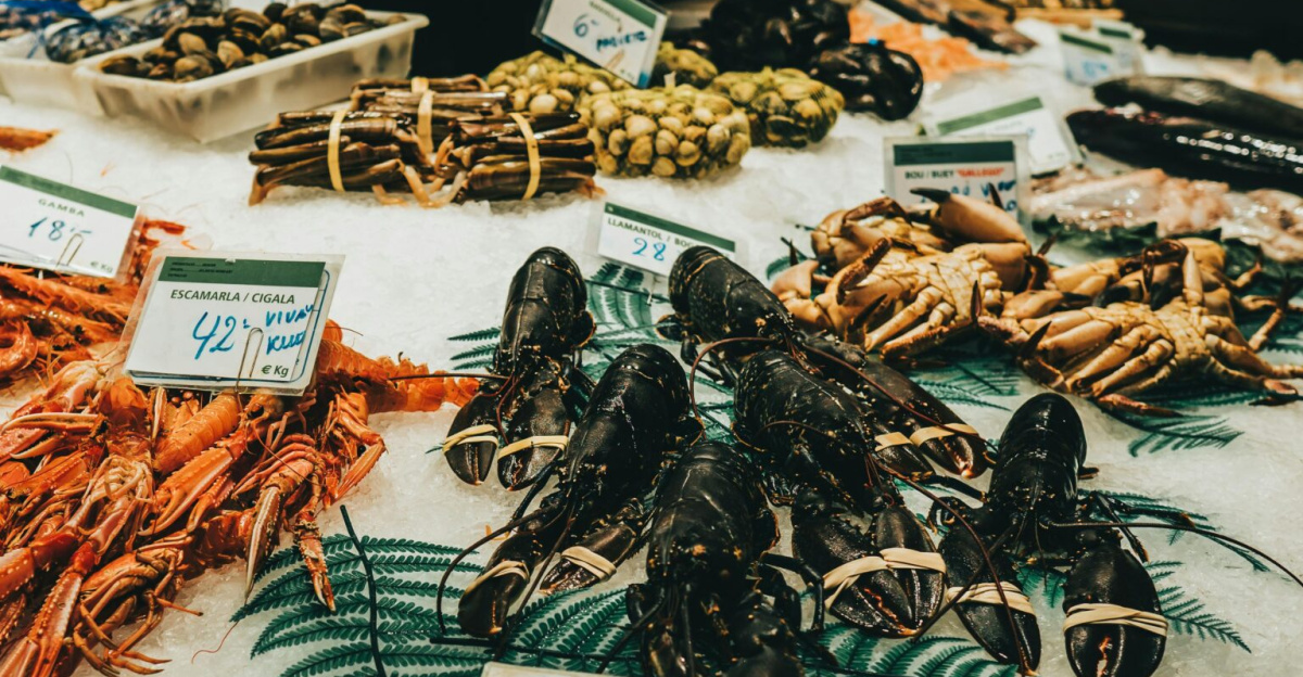 A vibrant display of fresh seafood at a market in Barcelona, Spain.