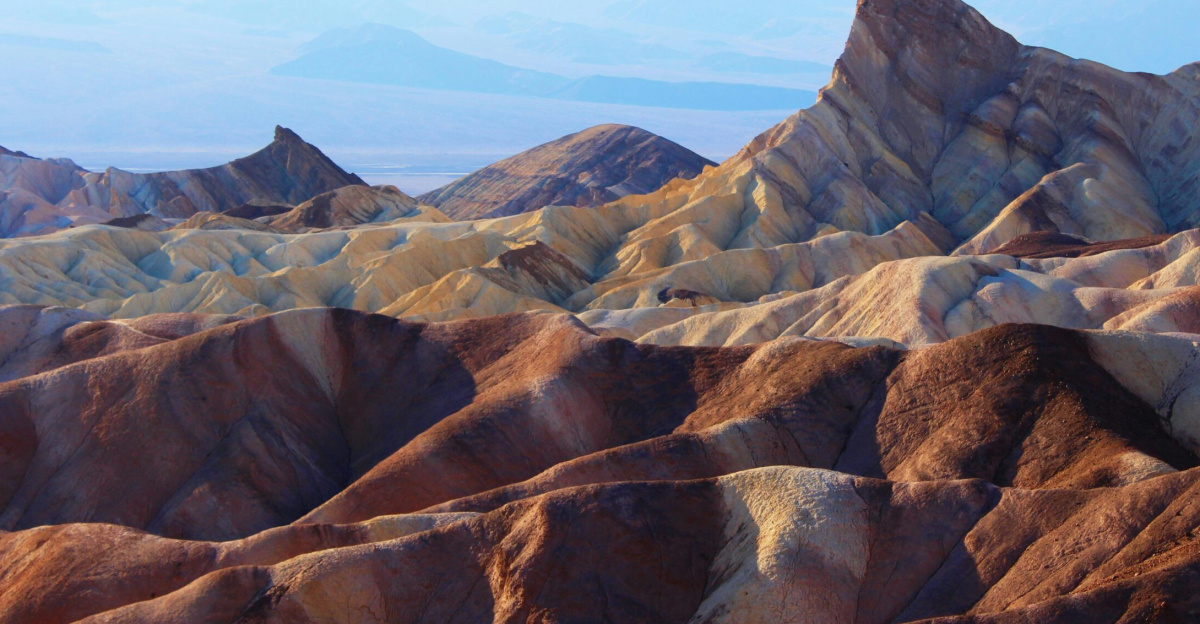 Stunning view of rock formations in Death Valley under bright daylight.