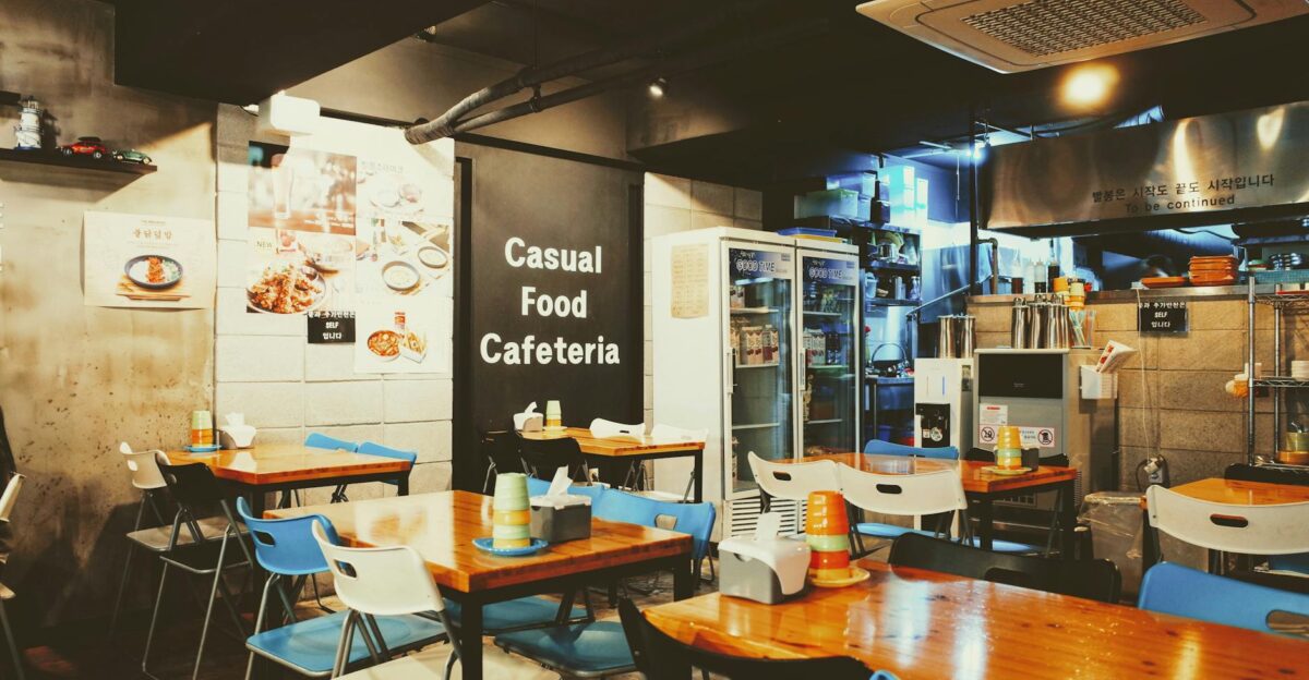 A cozy casual cafeteria interior with tables and chairs located in Busan South Korea