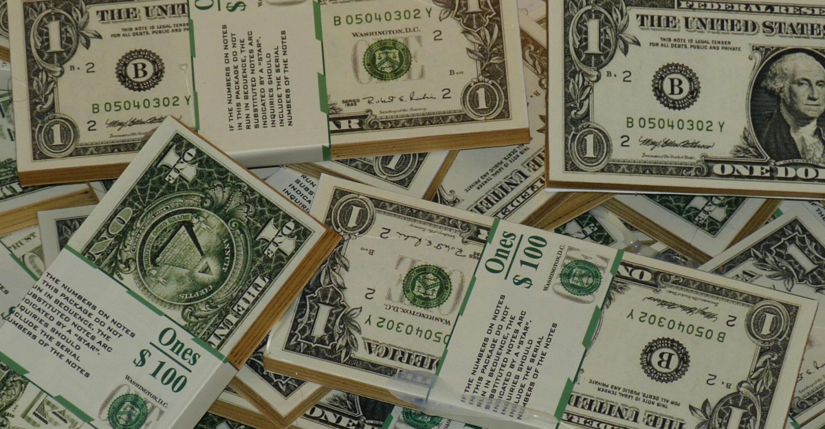 Numerous bundles of US one dollar bills symbolizing wealth, finance, and savings.