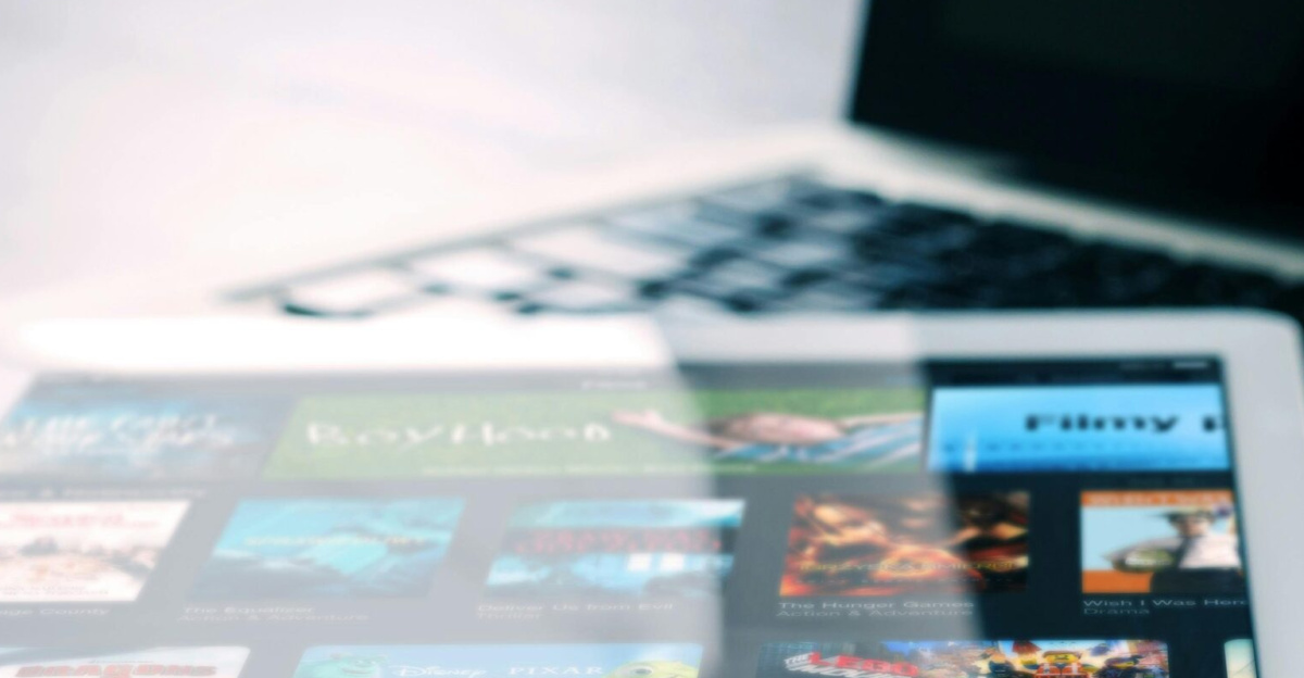 Tablet displaying streaming services on a laptop, illustrating digital entertainment setup.