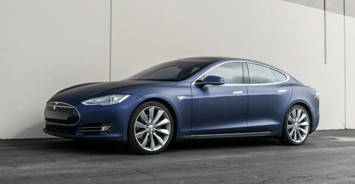 Elegant Tesla Model S parked outdoors against a modern backdrop showcasing luxury and innovation