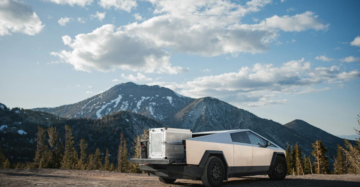 Tesla Cybertruck parked on mountain overlook against a breathtaking landscape Perfect blend of technology and nature