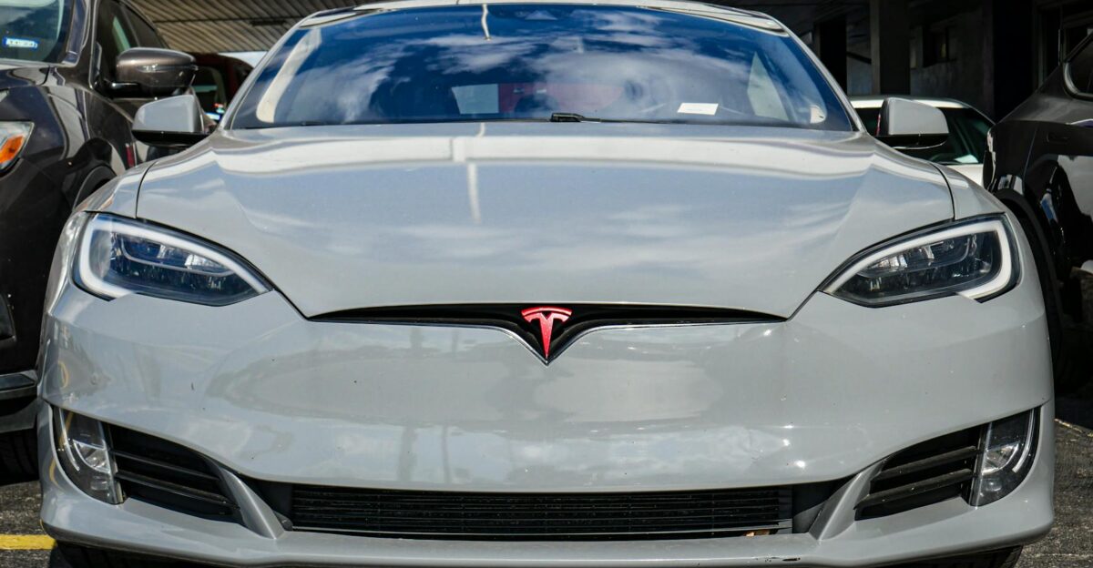 Front view of a Tesla Model S parked in an urban area highlighting sleek design and modern aesthetics