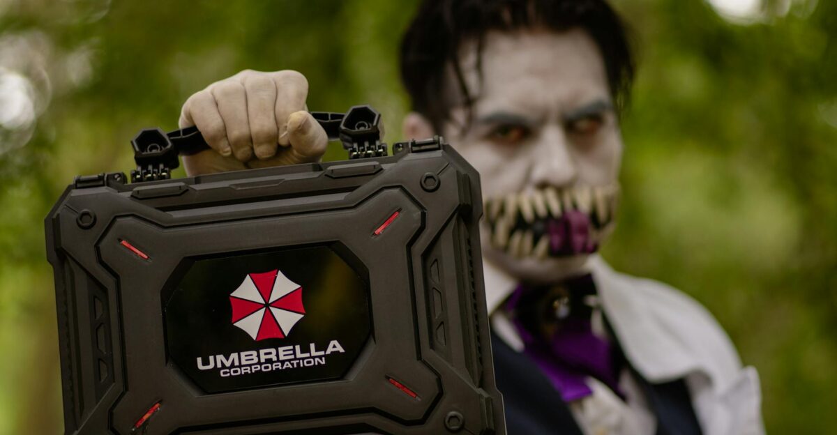 A cosplayer holding an Umbrella Corporation case inspired by Resident Evil ready for Halloween