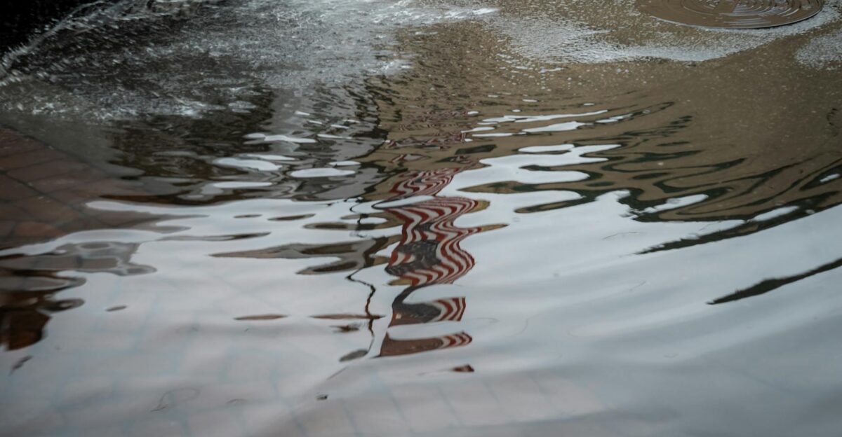Flooded street with water reflections in Savannah Georgia Urban rain aftermath