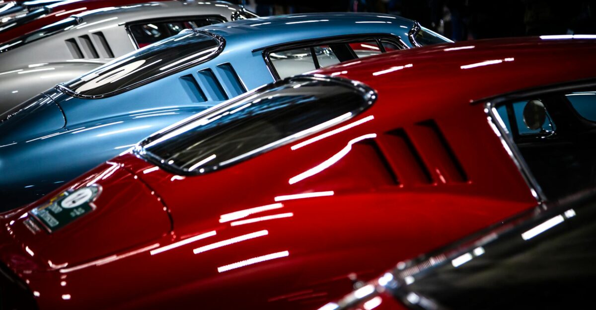 A striking lineup of vintage cars showcasing sleek design and vibrant colors