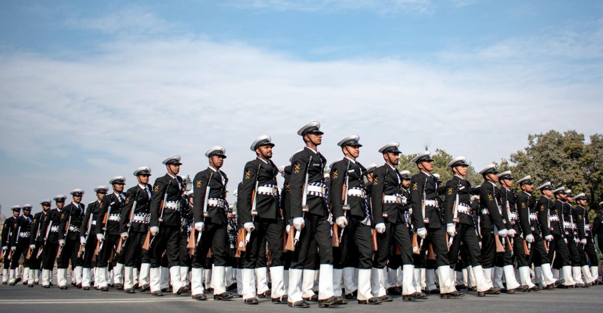 Indian naval officers in uniform marching in formation showcasing discipline and unity during a parade in New Delhi