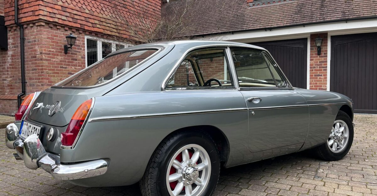 Classic silver MGB GT car parked in a driveway in Ascot England