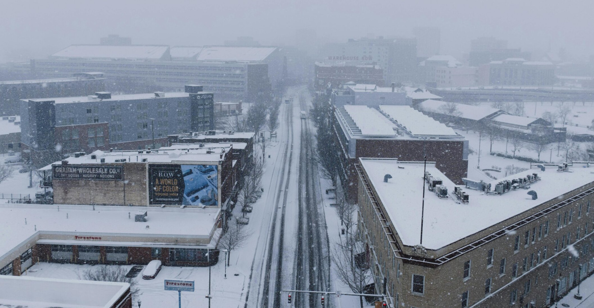 Aerial shot of Chattanooga city in heavy snowfall depicting a winter urban landscape.