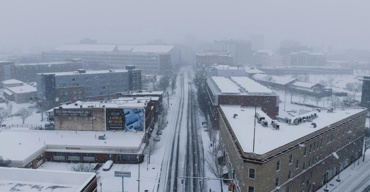 Aerial shot of Chattanooga city in heavy snowfall depicting a winter urban landscape.