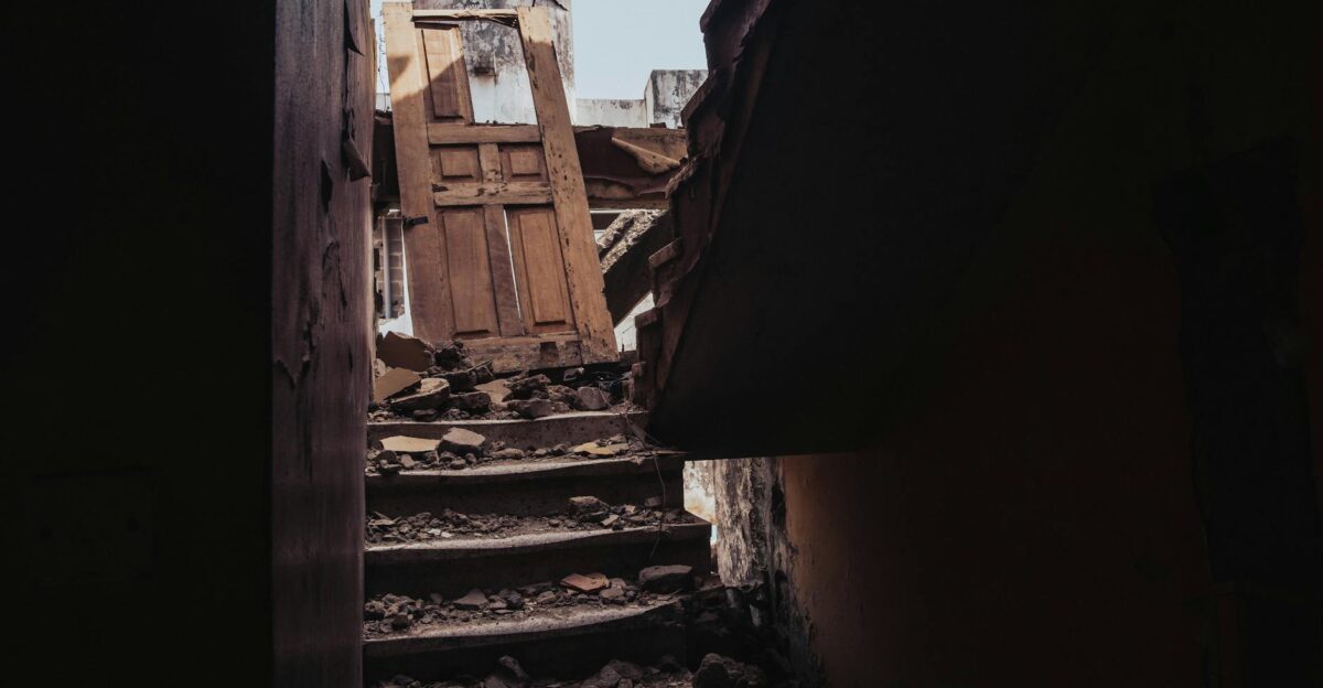 A view of a destroyed staircase amid rubble from a collapsed building in Ibadan Nigeria