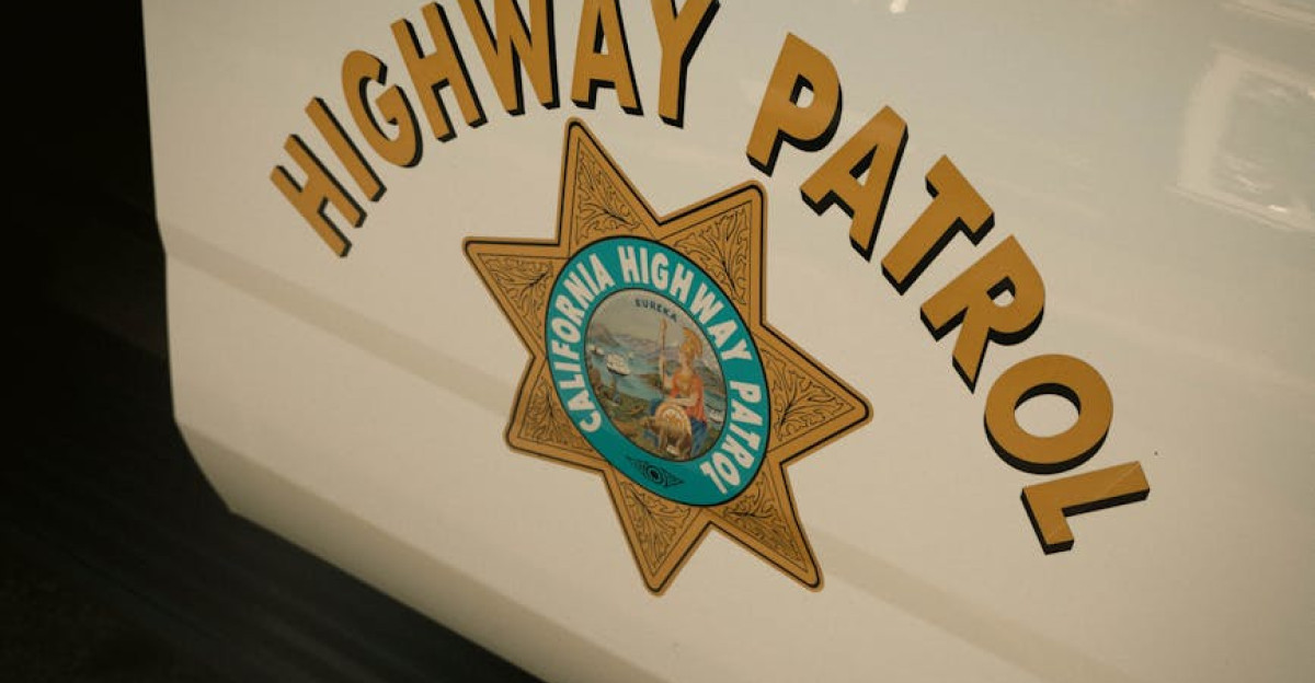 Side view of a California Highway Patrol vehicle with emblem
