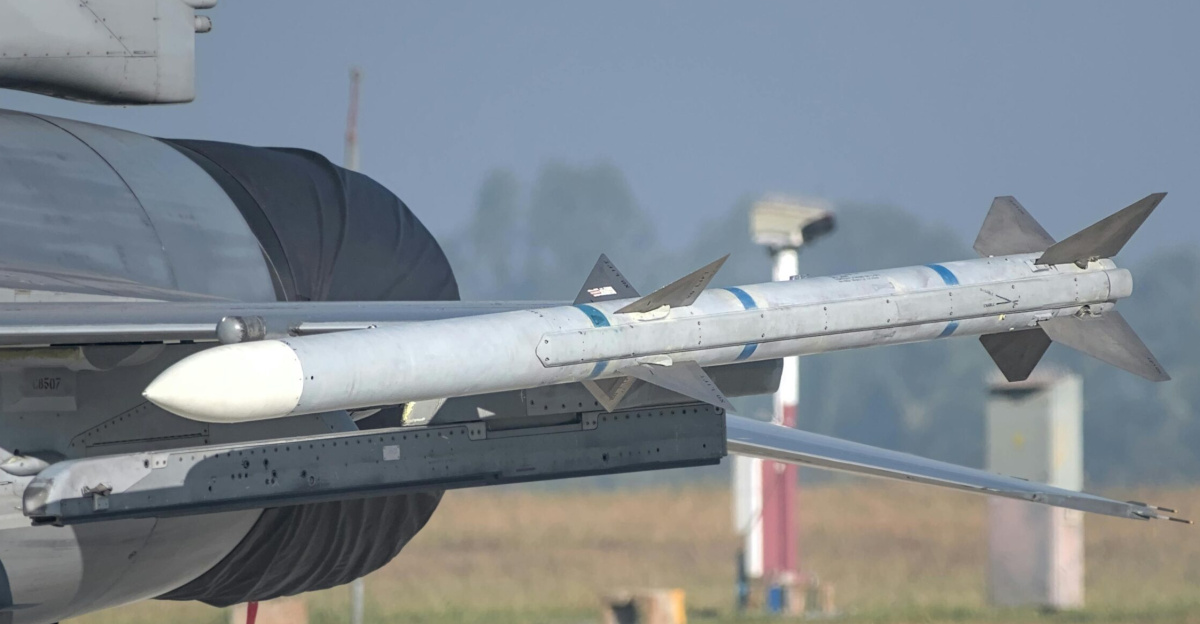 Close-up of a missile mounted on a military aircraft wing at an airshow in Bengaluru, India.