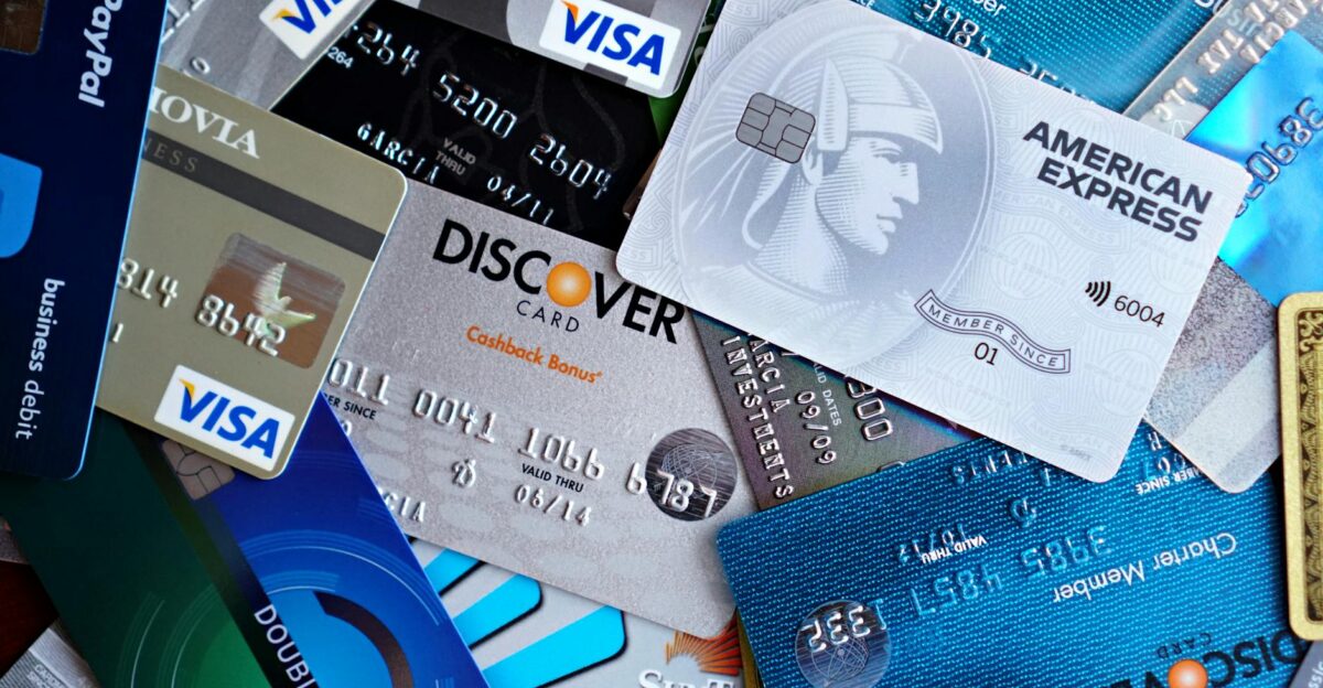 Close-up image of various credit cards including Visa Mastercard and American Express