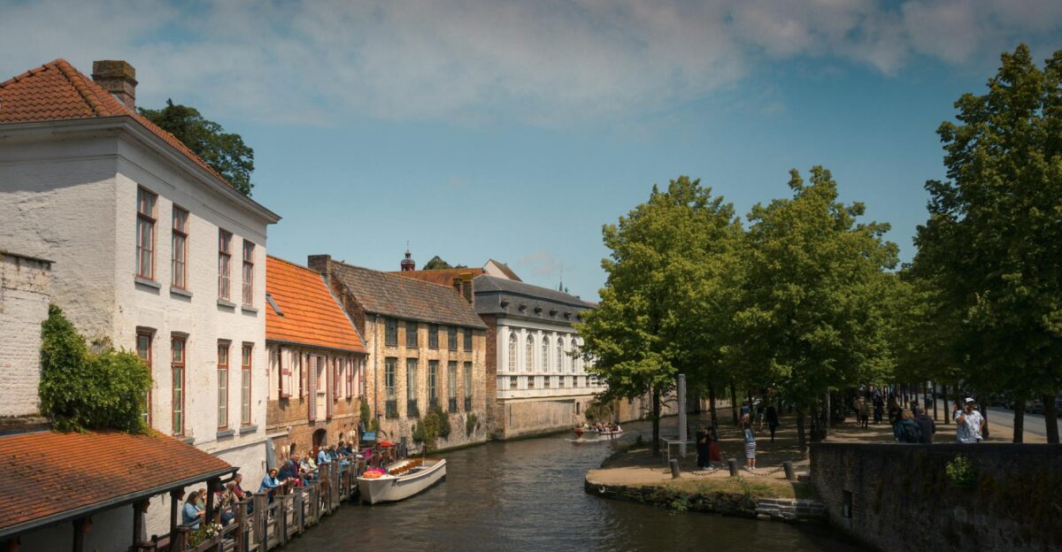 Sunny day along the scenic canal and historic buildings in Brugge Belgium
