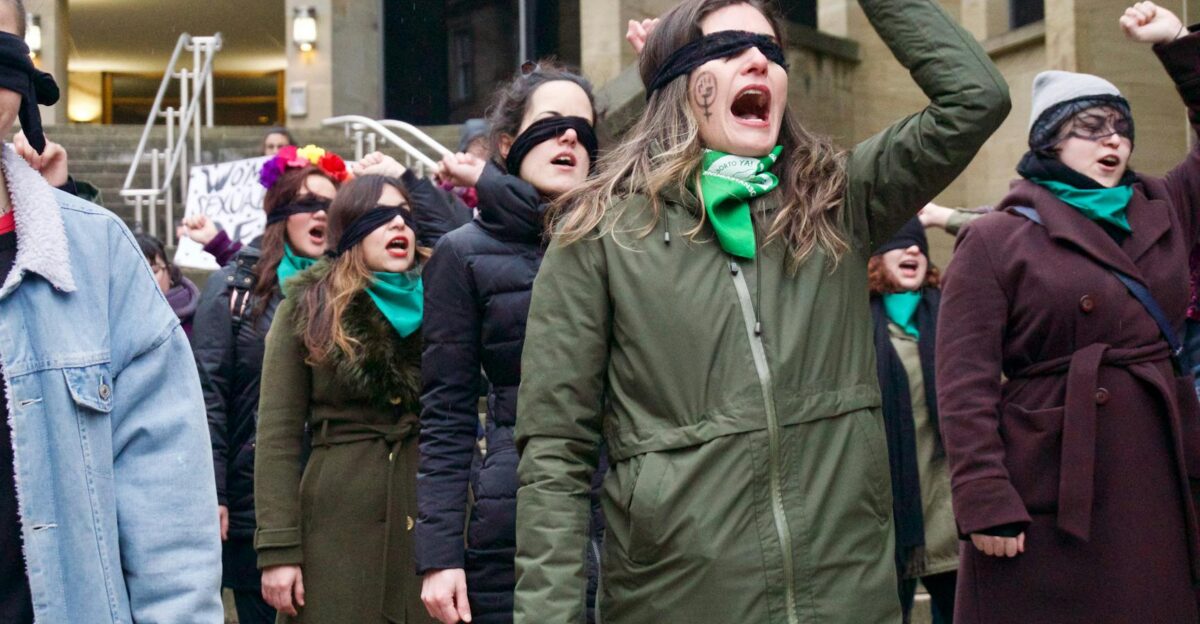 A dynamic group of women protesting for feminism and justice in Glasgow Scotland